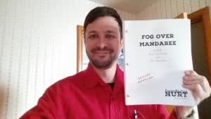 Frank and the manuscript for "Fog Over Mandaree"