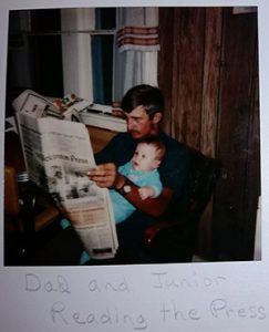 Frank and father reading newspaper